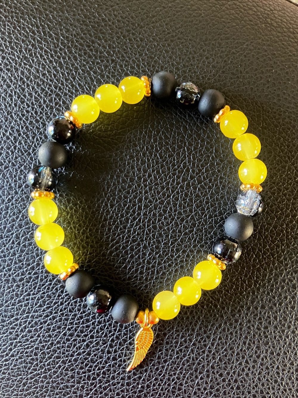 Black and Yellow Glass beaded Bracelet with Feather charm and gold accent